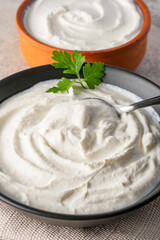 Traditional yogurt, full-fat or nonfat. Yogurt made from cow's or goat's milk on vintage  background