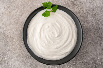 Traditional yogurt, full-fat or nonfat. Yogurt made from cow's or goat's milk on vintage background	