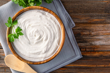 Traditional yogurt, full-fat or nonfat. Yogurt made from cow's or goat's milk on wooden background