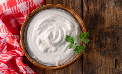 Traditional yogurt, full-fat or nonfat. Yogurt made from cow's or goat's milk on wooden background