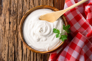 Traditional yogurt, full-fat or nonfat. Yogurt made from cow's or goat's milk on wooden background