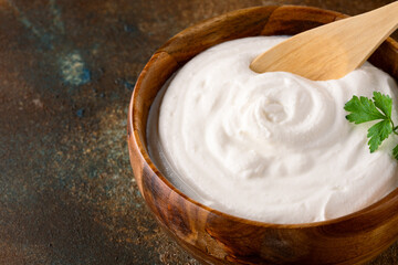 Traditional yogurt, full-fat or nonfat. Yogurt made from cow's or goat's milk on vintage background	