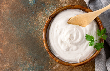 Traditional yogurt, full-fat or nonfat. Yogurt made from cow's or goat's milk on vintage background	