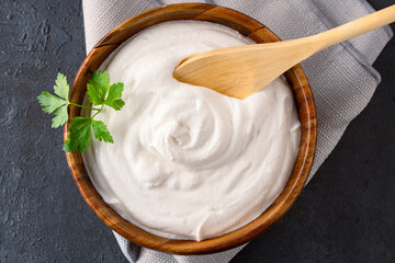 Traditional yogurt, full-fat or nonfat. Yogurt made from cow's or goat's milk on black background	
