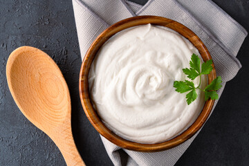 Traditional yogurt, full-fat or nonfat. Yogurt made from cow's or goat's milk on black background