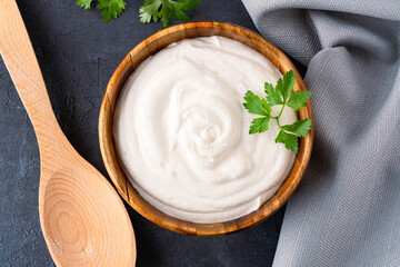 Traditional yogurt, full-fat or nonfat. Yogurt made from cow's or goat's milk on black background