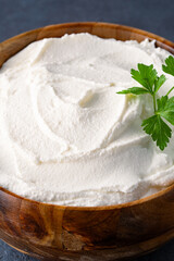 Traditional yogurt, full-fat or nonfat. Yogurt made from cow's or goat's milk on black background