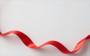 A smooth red ribbon curves elegantly against a plain white background. The ribbon has a glossy finish and creates a sense of movement.
