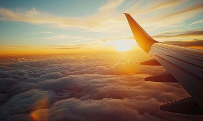 Airplane wing over clouds, golden sunset lighting