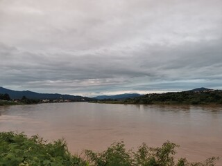 borderland view on cloudy sky on background