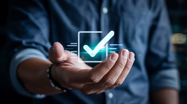 Close up of a person s open hand presenting a glowing digital checkmark within a transparent box representing success and completion - Powered by Adobe