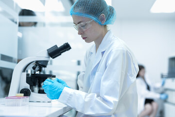 A researcher drives medical innovation using advanced technology. She focuses on scientific discovery, representing the future of healthcare, precision, and digital solutions.