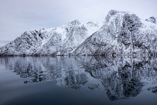 Silent Arctic Peaks Reflected in Stillness
