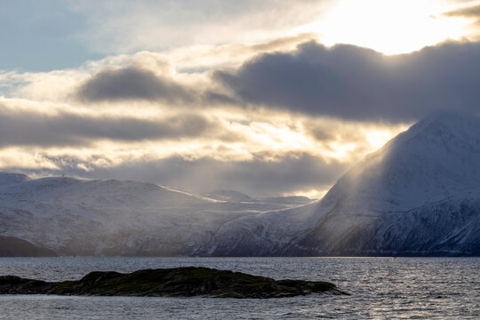 Sunbeams Breaking Through Arctic Clouds