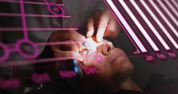 Male clinician placing tool, holding lid, working on eye for eye care while magenta charts overlay