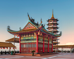 Fototapeta premium Chin Swee Caves Temple, Genting Highlands, Malaysia. Ornate traditional Chinese temple and pagoda with red lanterns under a clear sky