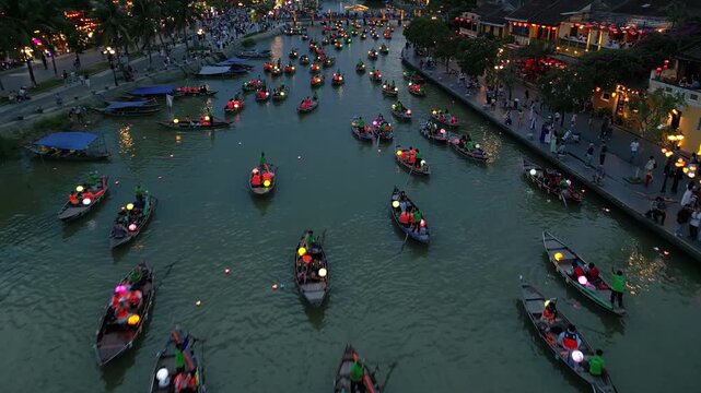 Asia, Vietnam , Hoi An, the city of lanterns, a UNESCO World Heritage Site . the traditional navigation with colored lanterns at night on the Thu Bon River - tourist attraction destination Vietnam 