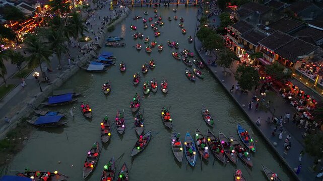 Asia, Vietnam , Hoi An, the city of lanterns, a UNESCO World Heritage Site . the traditional navigation with colored lanterns at night on the Thu Bon River - tourist attraction destination Vietnam 
