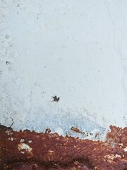 Grunge white metal texture with peeling paint and heavy rust corrosion background