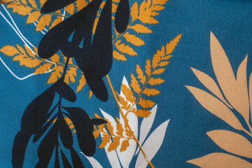 Blue and yellow print of leaves and flowers