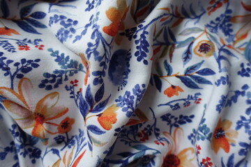 colorful viscose fabric with floral pattern in soft folds