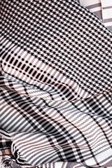 Checkered patterned fabric with black and white squares