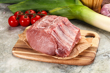 Raw pork loin cut with bone