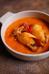 Padang style spicy curry squid in a bowl 