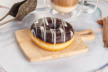 Delicous sweet donut with chocolate glaze