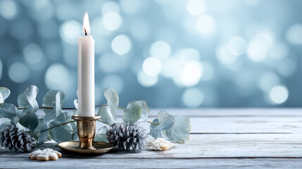 A beautiful candle surrounded by eucalyptus and pinecones on a rustic wooden table, evoking a peaceful holiday ambiance