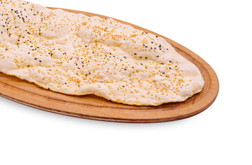 Fluffy bread with toppings served on a wooden platter during a meal