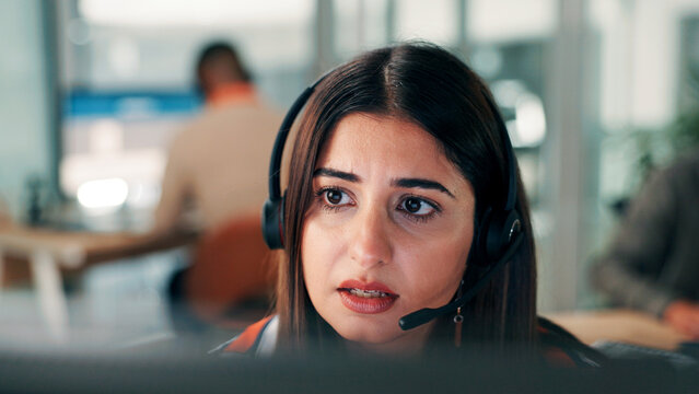 Woman, worry and customer service in office with computer for discussion, troubleshooting and advice. Concerned, person and coworking in call center with desktop for problem solving, support or help.