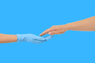 Hands reach out to connect in a professional medical setting