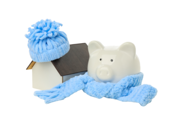 Winter-clad piggy bank with house decor, isolated on white, PNG