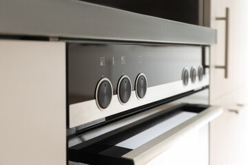 Oven control panel with dials and buttons ready for cooking
