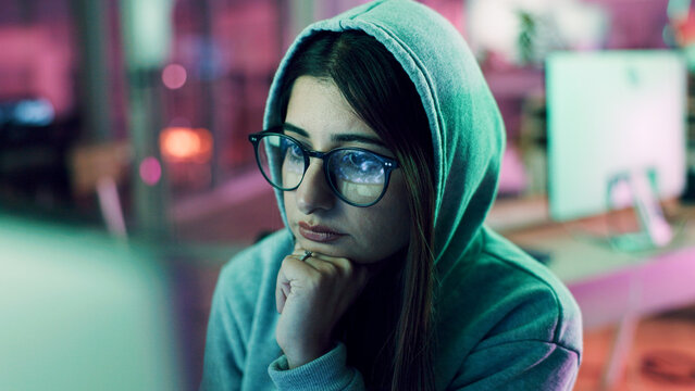 Night, hacking or woman with computer for encryption breach, firewall attack or cybersecurity crisis. Confidential info, system access or it programmer in dark data center, tech reflection or spyware