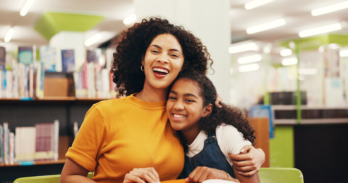 Portrait, mother and child in library with hug, teaching or comfort in literature hobby. Happiness, education and family at table with embrace, reading support and guidance for academic development.