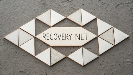 Abstract wooden fragments arranged to form Recovery Net