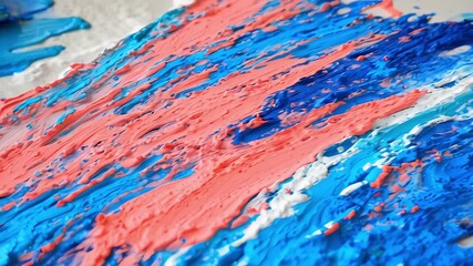 This vibrant video showcases an abstract painting process, where bold strokes of blue and coral blend harmoniously on the canvas. The dynamic textures invite viewers into a world of creativity and col