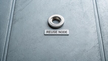Metal Washer and Reuse Node on a Gray Surface