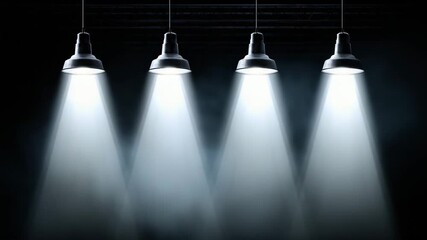 Four industrial spotlights illuminate a dark stage with dramatic beams of light creating an - Powered by Adobe