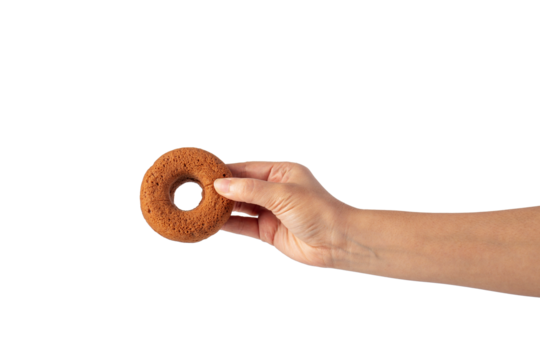Chocolate round donut in hand on transparent background - Powered by Adobe