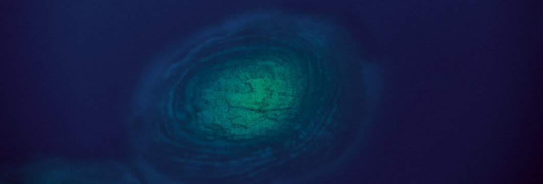 Aerial view of the vibrant green island surrounded by the deep blue sea, creating a mesmerizing contrast of colors, Brioni Islands, Istria, Croatia.
