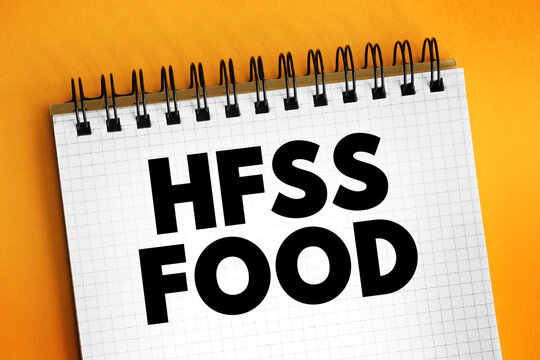 HFSS Food - term for food and beverage products which are high in saturated fat, salt and sugar, text concept on notepad