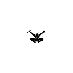 Silhouette of a ninja in a squatting pose holding nunchucks