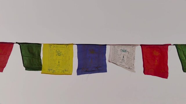 Himalayas prayer flags flutter in wind. Buddhist Lungta banners blowing on mountain pass, symbolizing peace, wisdom, compassion. High altitude travel, culture, religion footage.