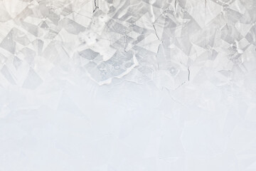 Naklejka premium white winter background, frosty patterns on glass, abstract backdrop of ice and snow crystals in a blur