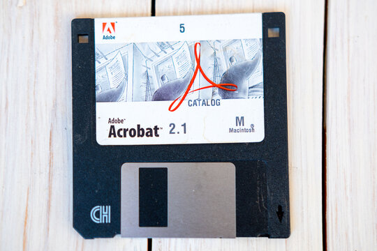 Vintage 3.5 inch floppy disk Adobe Acrobat 2.1, Macintosh version computing, digital history, software tech artifact, retro tech nostalgia, analog and digital storage, old school computing history