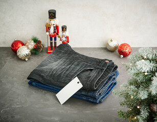 A stylish display of various washed denim jeans hanging on a metal grid rack, showcasing different textures, colors, and modern casual fashion details.