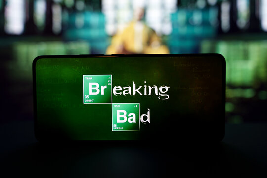 Breaking Bad logo on smartphone screen with science lab background